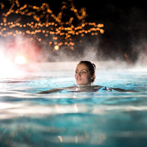 Enjoying-a-Heated-Pool-at-Night-Nanotek-Solution-by-AES-Poolheating-768x768